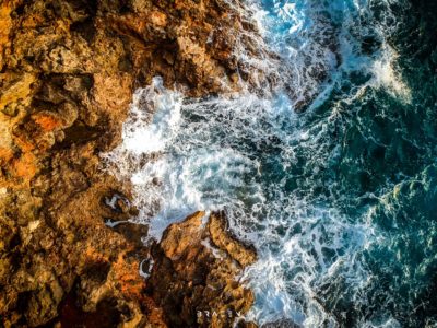 Aerial drone shot looking down over stormy sea