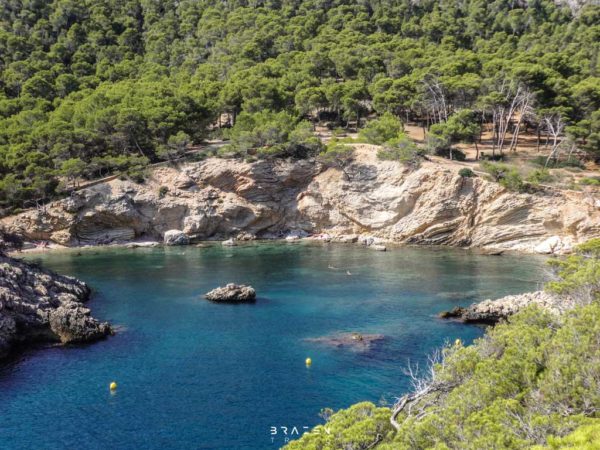 Secluded bay with clear blue ocean Cala d'en monjo